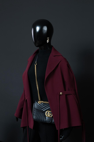 Burnt Maroon texted blazer with chic hangings and dull gold buttons can be paired with black turtle neck and black bell bottoms. You can also pair offwhite shirt with this blazer to give it a formal touch.